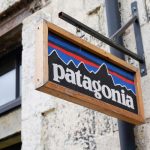 Patagonia logo on a wooden sign outside a store